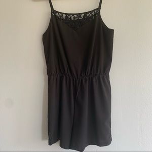 Black romper with lace top and short detail, M